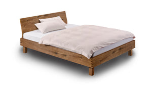 Holzmanufaktur Massivholzbett Step-X XL mit eingerückten Beinen